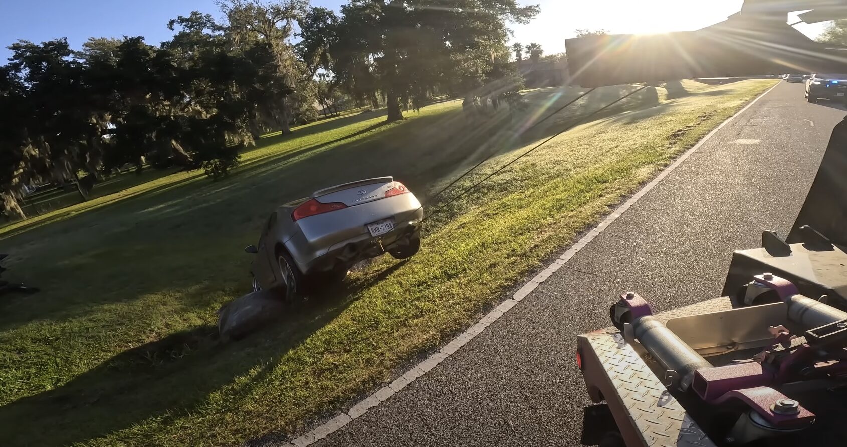 Emergency towing service in Friendswood - tow truck loading silver car