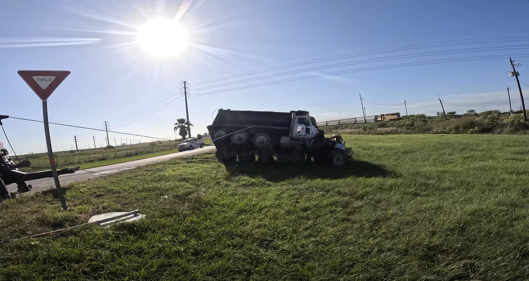 Professional Accident Recovery Towing Service in Friendswood, TX Accident recovery scene with overturned truck and emergency vehicles